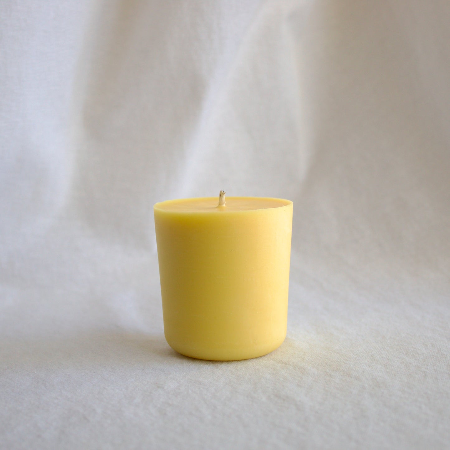 Refillable naturally scented mood boosting wellness candle