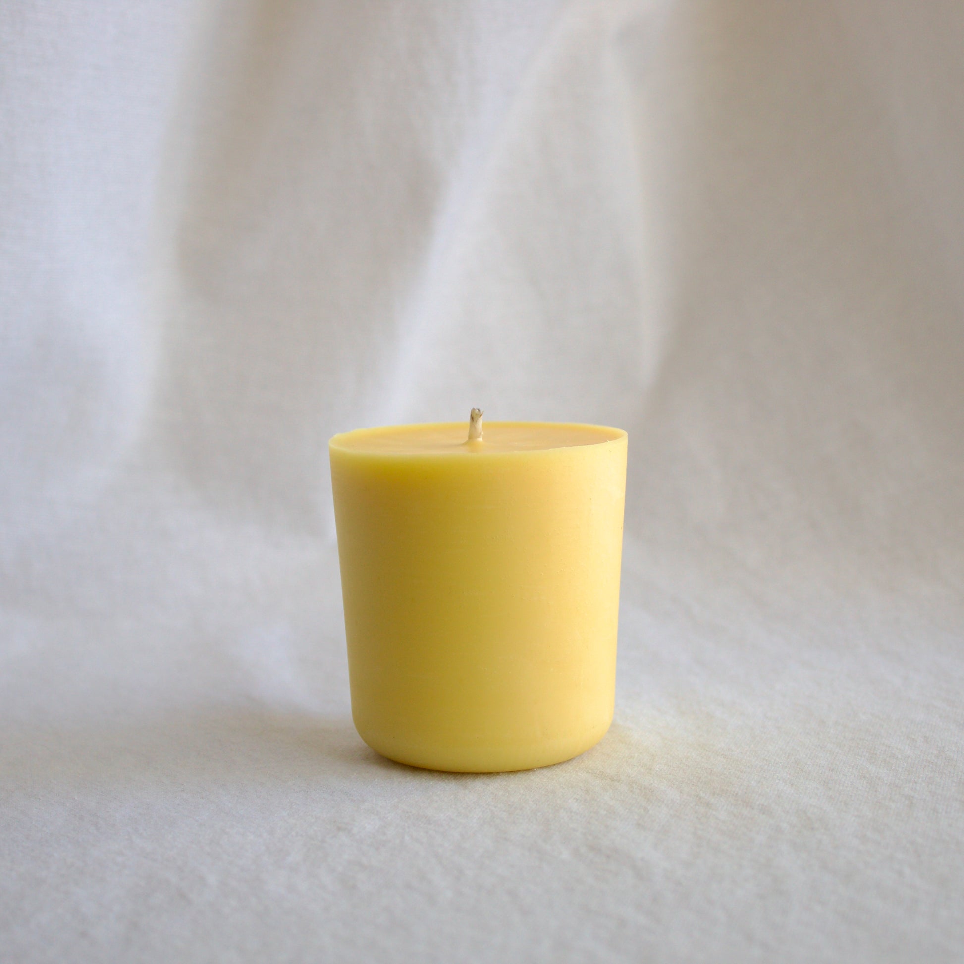 Refillable naturally scented mood boosting wellness candle