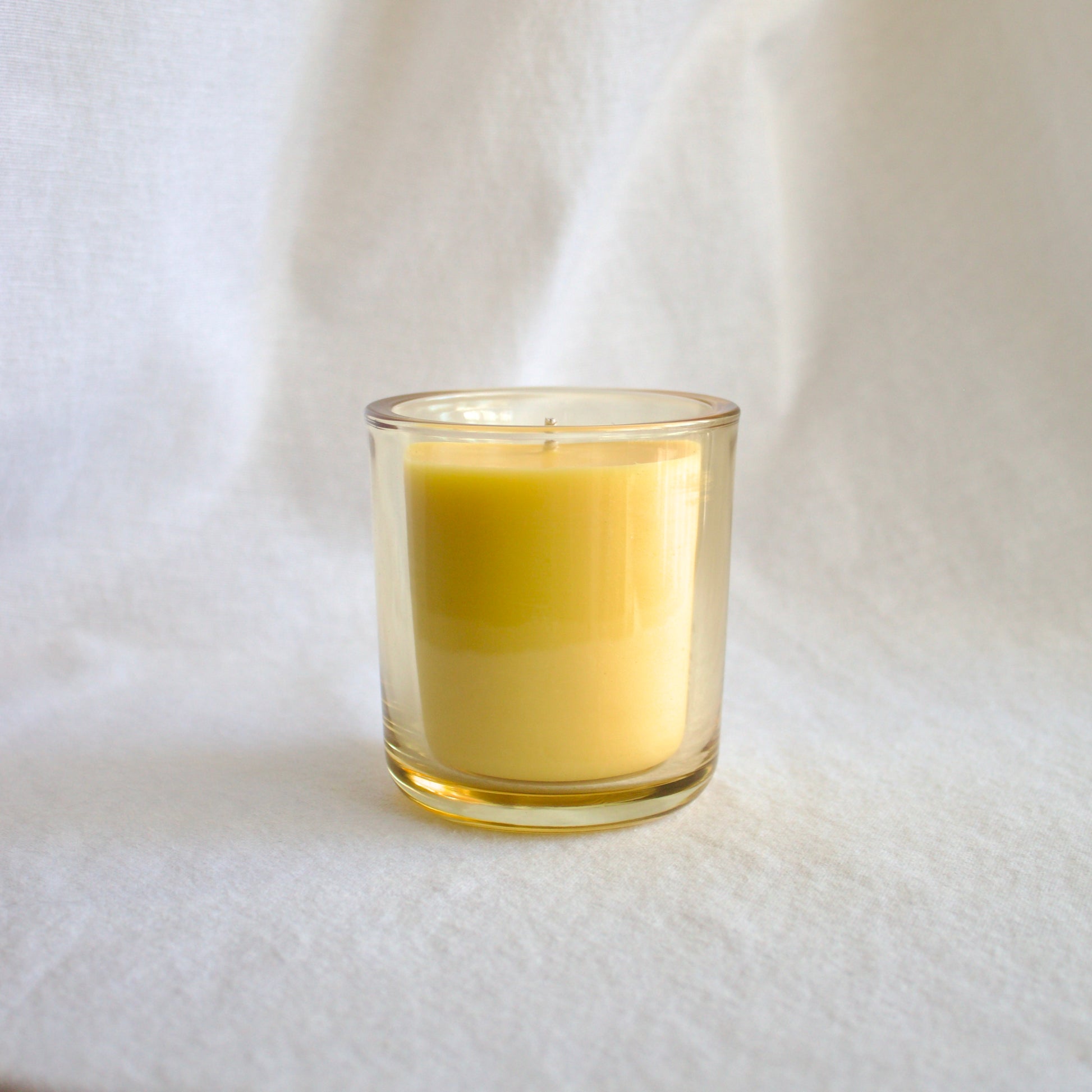 Refillable naturally scented mood boosting wellness candle 