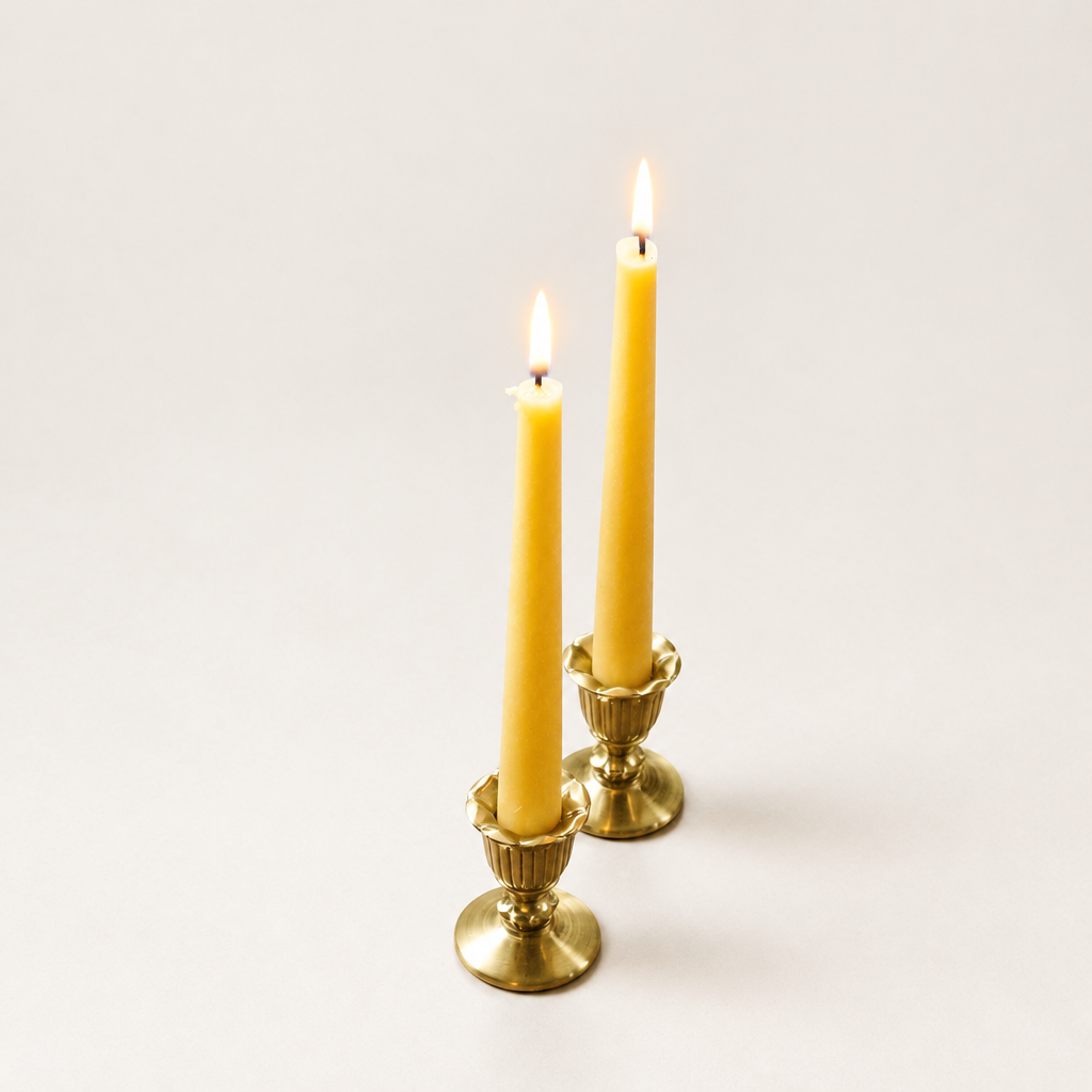 Beeswax tapers on soft off-white with lighter shadows