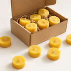 Beeswax tealights on soft off-white with lighter shadows